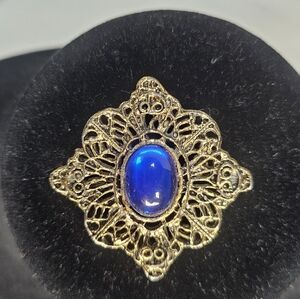 Vintage Victorian-Style Gold-Tone Filigree Brooch with Royal Blue Cabochon